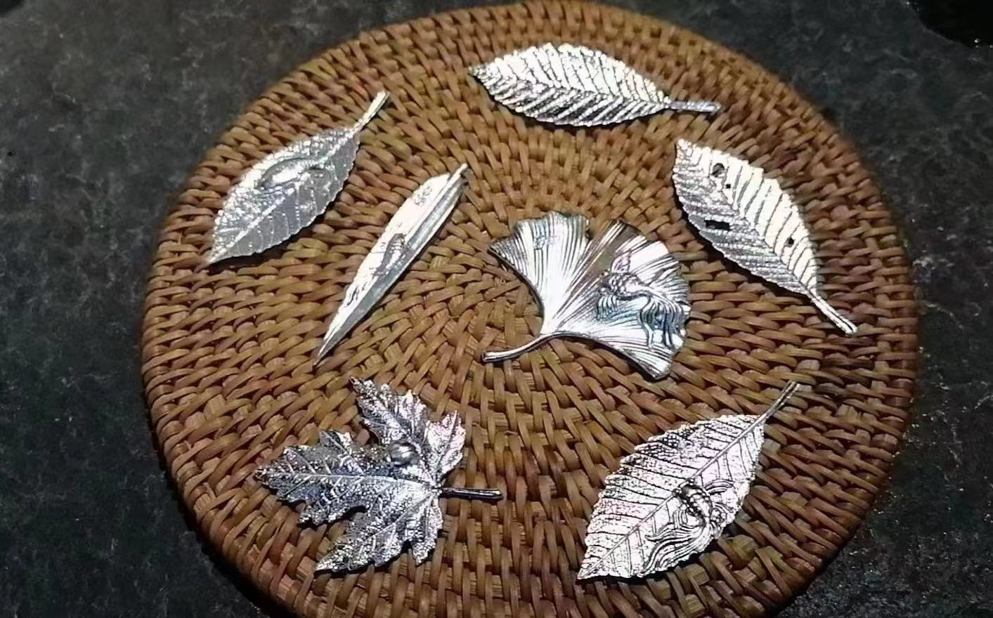 Silver water filter fish and mapple leaves